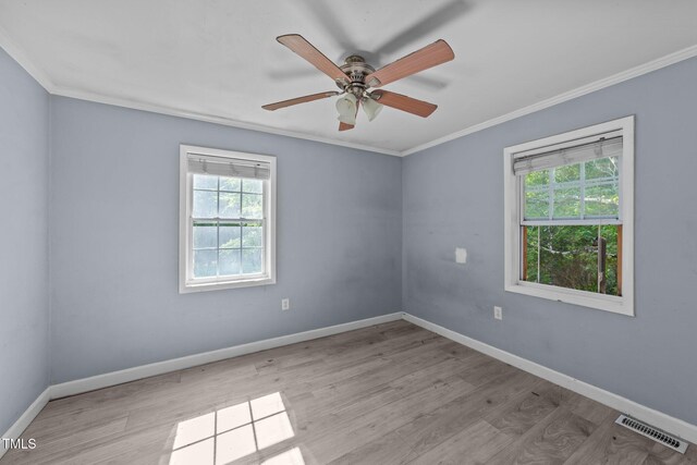 282 Cooke Rd, Louisburg, NC 27549 - empty room featuring plenty of natural light, ornamental molding, wood finished floors, and baseboards