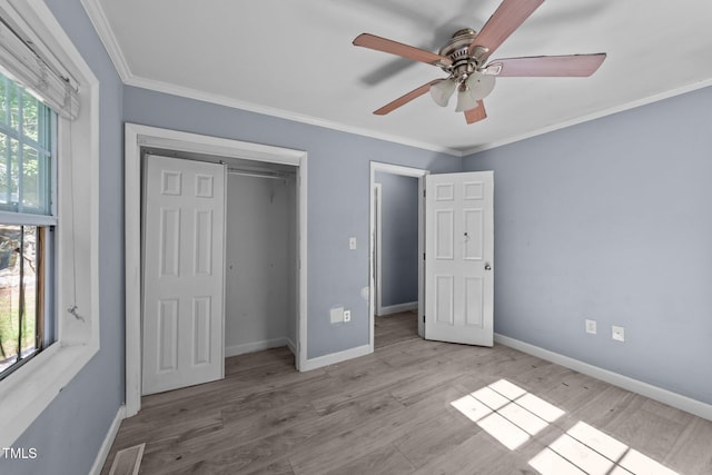 282 Cooke Rd, Louisburg, NC 27549 - unfurnished bedroom featuring baseboards, ornamental molding, a closet, and wood finished floors