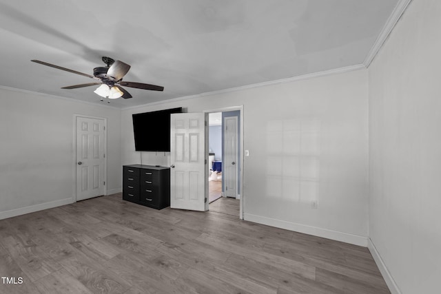 282 Cooke Rd, Louisburg, NC 27549 - unfurnished living room featuring ornamental molding, a ceiling fan, baseboards, and wood finished floors