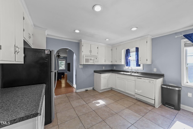 282 Cooke Rd, Louisburg, NC 27549 - kitchen featuring white appliances, a sink, recessed lighting, baseboards, and arched walkways