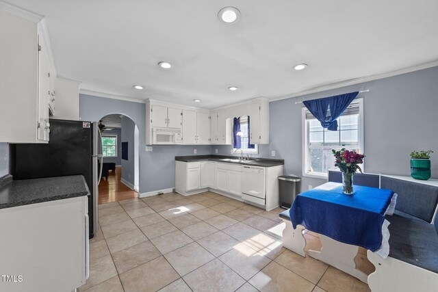 282 Cooke Rd, Louisburg, NC 27549 - kitchen with white appliances, a sink, crown molding, arched walkways, and dark countertops
