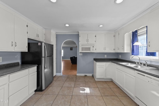 282 Cooke Rd, Louisburg, NC 27549 - kitchen with white appliances, arched walkways, a sink, ornamental molding, and healthy amount of natural light