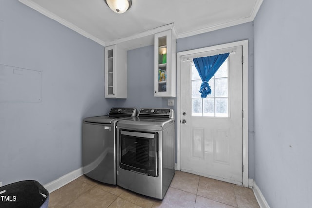 282 Cooke Rd, Louisburg, NC 27549 - washroom with washing machine and dryer, ornamental molding, baseboards, and light tile patterned floors