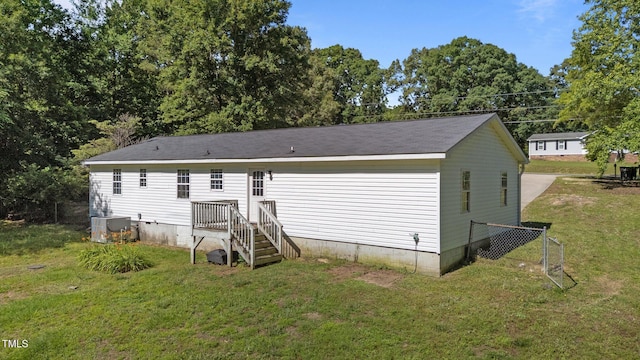 282 Cooke Rd, Louisburg, NC 27549 - back of property with a yard and cooling unit