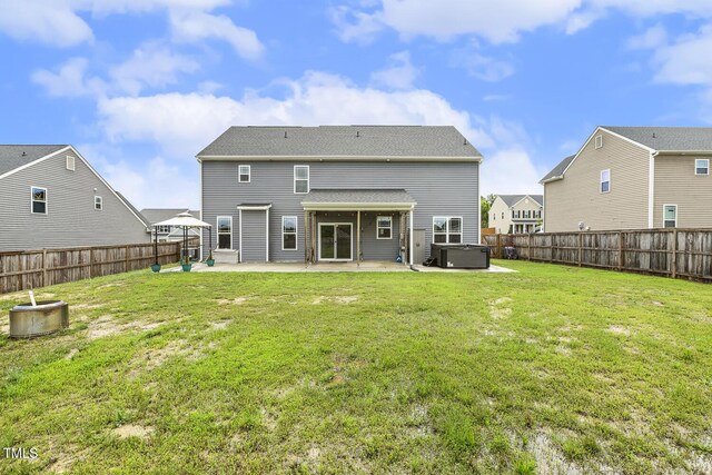 225 Rosewood Ln, Youngsville, NC 27596 - back of house featuring a hot tub, a patio, and central air condition unit
