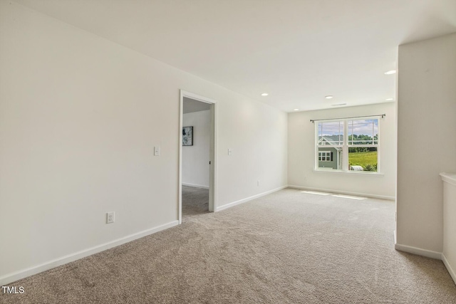 225 Rosewood Ln, Youngsville, NC 27596 - carpeted spare room with baseboards and recessed lighting