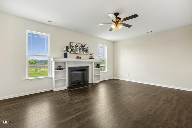 225 Rosewood Ln, Youngsville, NC 27596 - unfurnished living room with ceiling fan, dark wood-type flooring, and healthy amount of natural light