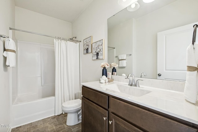 225 Rosewood Ln, Youngsville, NC 27596 - bathroom featuring vanity, toilet, shower / bath combo with shower curtain, and stone finish flooring