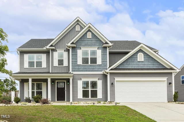 225 Rosewood Ln, Youngsville, NC 27596 - craftsman inspired home featuring concrete driveway, a front lawn, a garage, and a shingled roof