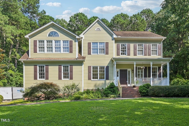 6829 Wood Forest Dr, Cary, NC 27519 - colonial inspired home featuring a porch and a front yard