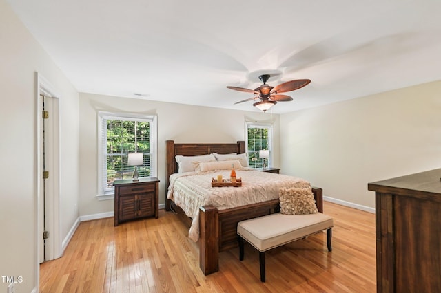 6829 Wood Forest Dr, Cary, NC 27519 - bedroom featuring light wood-type flooring and ceiling fan