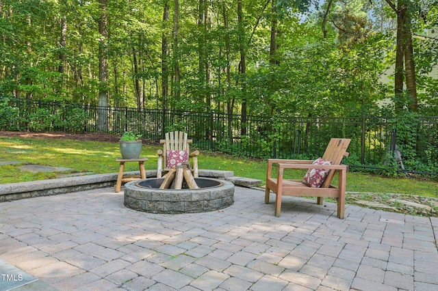6829 Wood Forest Dr, Cary, NC 27519 - fenced backyard featuring a patio area and a fire pit