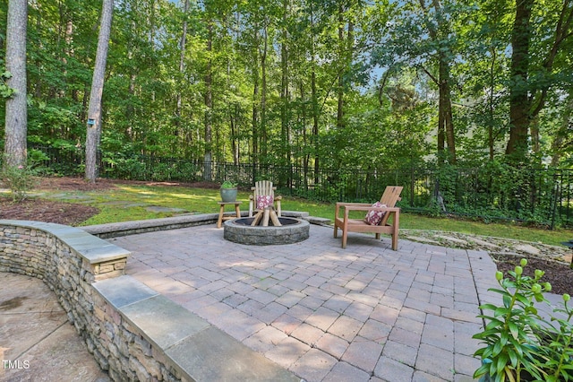6829 Wood Forest Dr, Cary, NC 27519 - fenced backyard with an outdoor fire pit and a patio