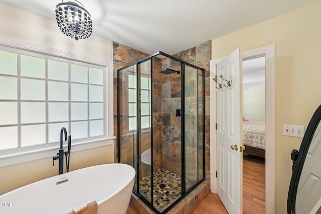 6829 Wood Forest Dr, Cary, NC 27519 - full bathroom with ensuite bath, a soaking tub, wood finished floors, and a stall shower