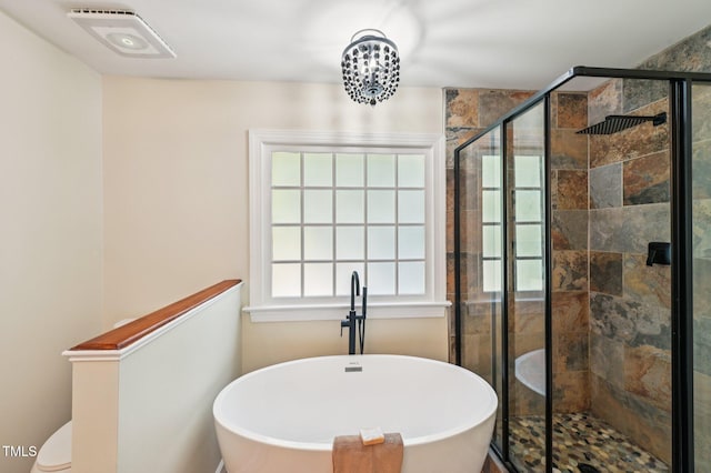 6829 Wood Forest Dr, Cary, NC 27519 - bathroom with a freestanding tub and a stall shower