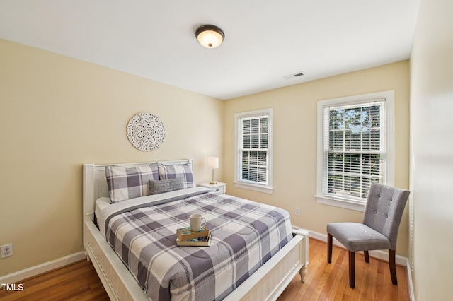 6829 Wood Forest Dr, Cary, NC 27519 - bedroom with baseboards and wood finished floors