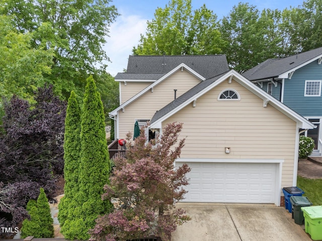 10579 Evergreen Spring Pl, Raleigh, NC 27614 - view of property exterior with concrete driveway and a garage