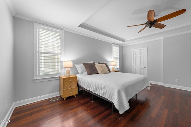 10579 Evergreen Spring Pl, Raleigh, NC 27614 - bedroom with crown molding, wood finished floors, baseboards, a raised ceiling, and a ceiling fan