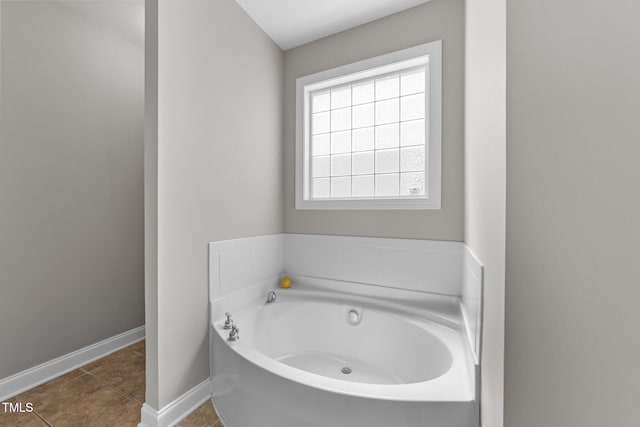 10579 Evergreen Spring Pl, Raleigh, NC 27614 - bathroom featuring a bath, baseboards, and tile patterned flooring