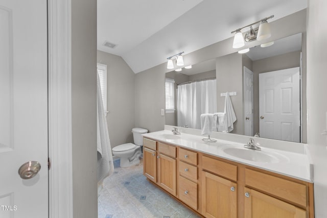 10579 Evergreen Spring Pl, Raleigh, NC 27614 - bathroom with tile patterned flooring, toilet, double vanity, vaulted ceiling, and a shower with shower curtain