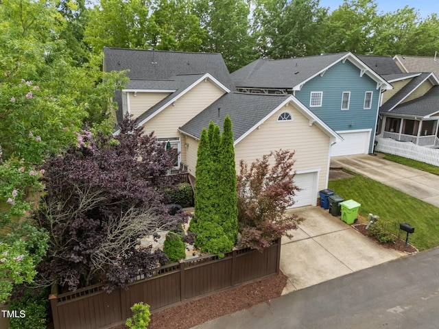 10579 Evergreen Spring Pl, Raleigh, NC 27614 - view of front facade with concrete driveway, a garage, and a shingled roof