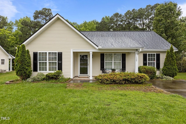 139 Carriage Hill Dr, Stem, NC 27581 - view of front of home featuring covered porch, a front yard, and roof with shingles