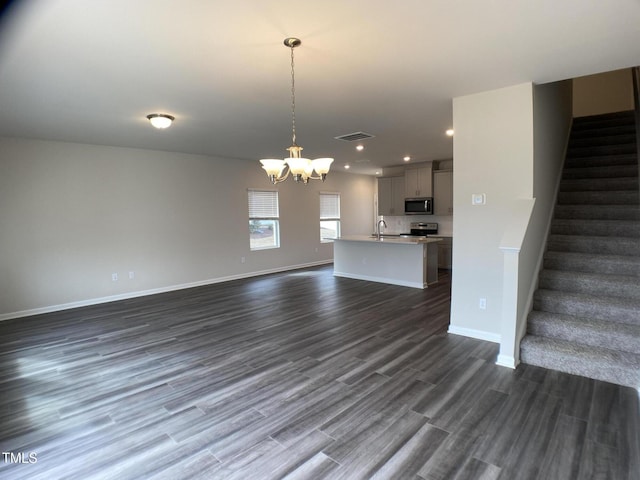 909 Clearhaven Ln Unit 909, Fuquay Varina, NC 27526 - unfurnished living room with a chandelier, recessed lighting, stairway, dark wood-style floors, and a sink