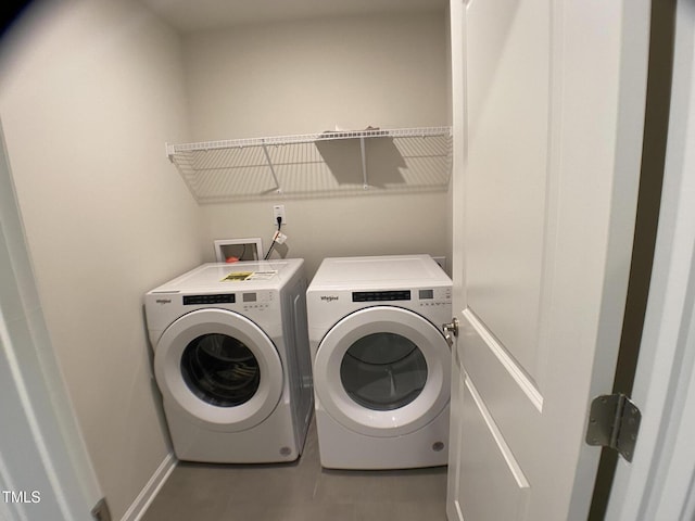 909 Clearhaven Ln Unit 909, Fuquay Varina, NC 27526 - laundry area with washer and dryer, tile patterned flooring, and baseboards