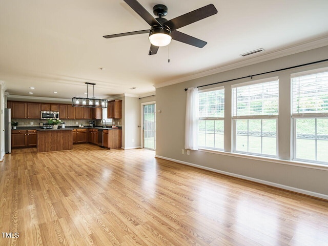 1833 Creek Oak Cir, Fuquay Varina, NC 27526 - unfurnished living room featuring ornamental molding, baseboards, light wood-type flooring, ceiling fan, and recessed lighting