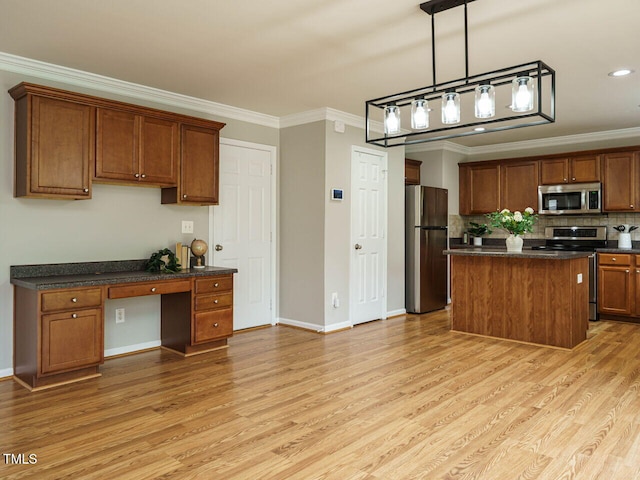1833 Creek Oak Cir, Fuquay Varina, NC 27526 - kitchen featuring appliances with stainless steel finishes, ornamental molding, dark countertops, light wood-type flooring, and tasteful backsplash