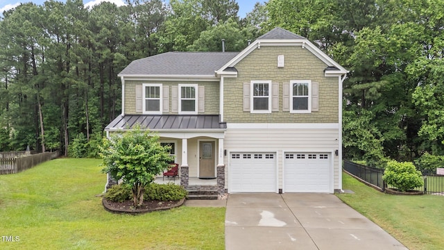 2709 Banks Lake Ct, Fuquay Varina, NC 27526 - craftsman inspired home with covered porch, concrete driveway, an attached garage, a standing seam roof, and a shingled roof