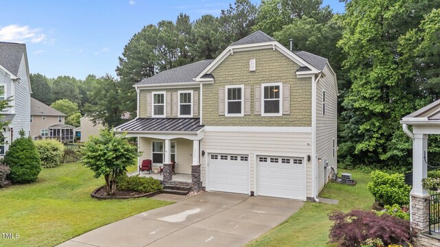 2709 Banks Lake Ct, Fuquay Varina, NC 27526 - craftsman-style home featuring a porch, concrete driveway, a garage, and a standing seam roof