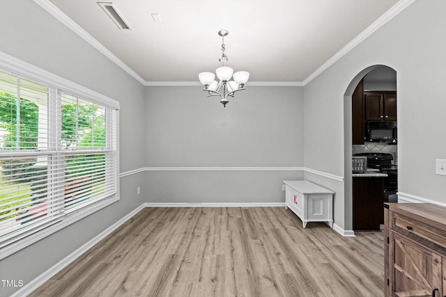 2709 Banks Lake Ct, Fuquay Varina, NC 27526 - unfurnished dining area featuring light wood-type flooring, a chandelier, ornamental molding, arched walkways, and baseboards