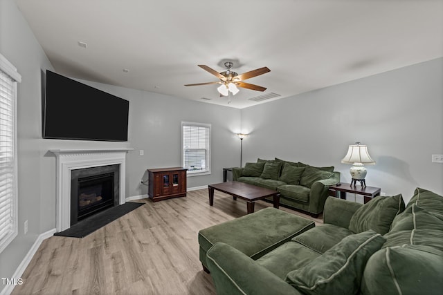 2709 Banks Lake Ct, Fuquay Varina, NC 27526 - living area with a ceiling fan, light wood-type flooring, and baseboards