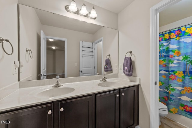 2709 Banks Lake Ct, Fuquay Varina, NC 27526 - bathroom featuring double vanity, toilet, and a shower with curtain
