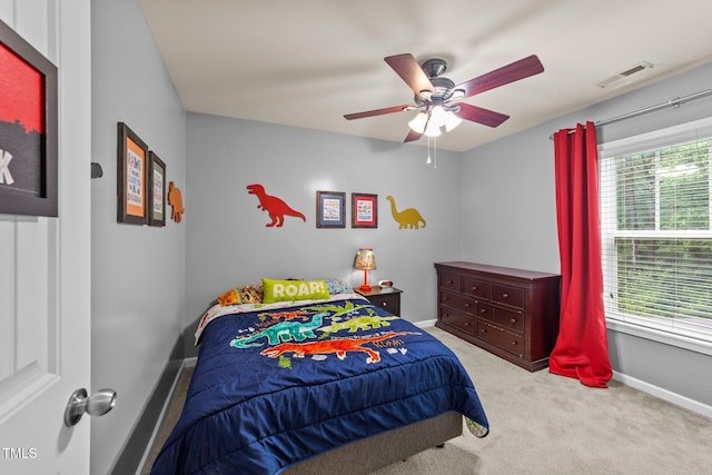 2709 Banks Lake Ct, Fuquay Varina, NC 27526 - carpeted bedroom featuring multiple windows, baseboards, and ceiling fan