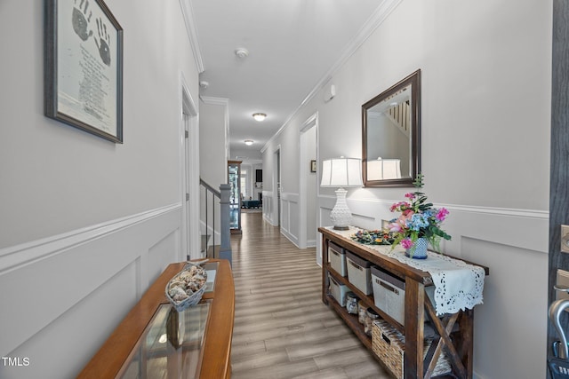 461 Cedar Pond Ct, Knightdale, NC 27545 - hall featuring ornamental molding, stairs, light wood-style floors, and a wainscoted wall