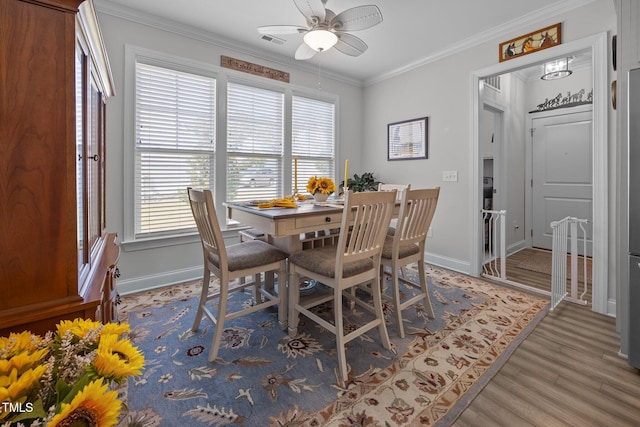 461 Cedar Pond Ct, Knightdale, NC 27545 - dining room featuring ornamental molding, ceiling fan, baseboards, and wood finished floors