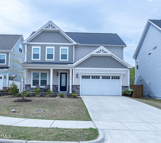 1950 Menet St, Apex, NC 27502 - craftsman-style house with covered porch, stone siding, and concrete driveway