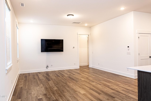 1950 Menet St, Apex, NC 27502 - unfurnished living room with wood finished floors, baseboards, and recessed lighting