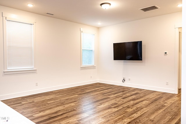 1950 Menet St, Apex, NC 27502 - unfurnished living room featuring wood finished floors, baseboards, and recessed lighting