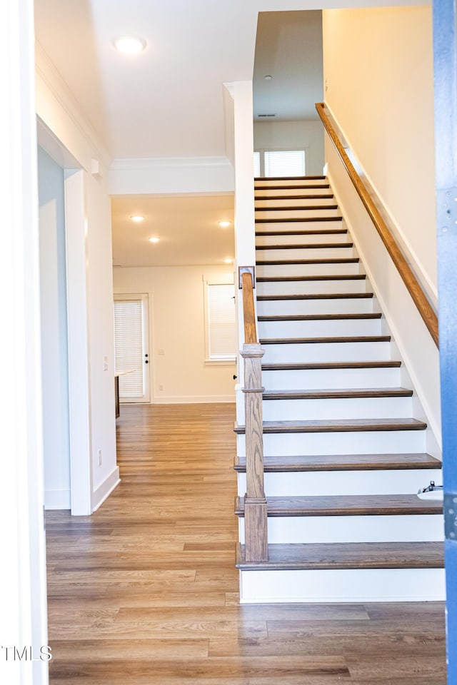 1950 Menet St, Apex, NC 27502 - staircase with wood finished floors, crown molding, baseboards, and recessed lighting