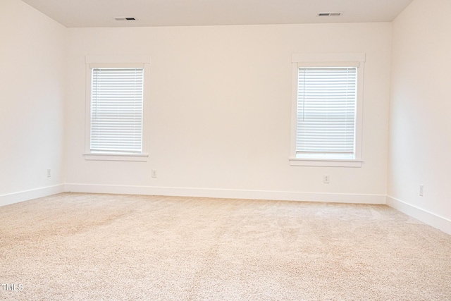 1950 Menet St, Apex, NC 27502 - unfurnished room with light colored carpet, healthy amount of natural light, and baseboards