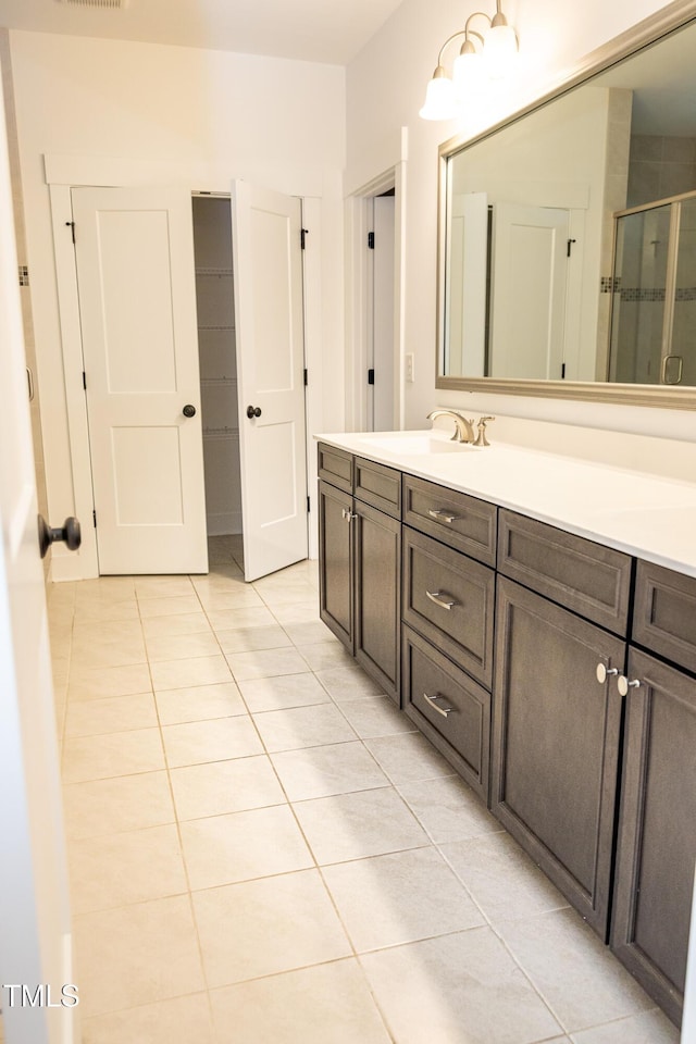 1950 Menet St, Apex, NC 27502 - bathroom with tile patterned floors, vanity, and a stall shower