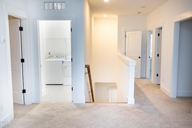 1950 Menet St, Apex, NC 27502 - hall with carpet floors, washing machine and clothes dryer, and an upstairs landing