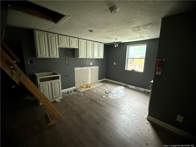 209 Rose St, Spring Lake, NC 28390 - kitchen with a textured ceiling and baseboards