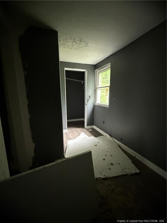 209 Rose St, Spring Lake, NC 28390 - unfurnished bedroom with baseboards and a closet