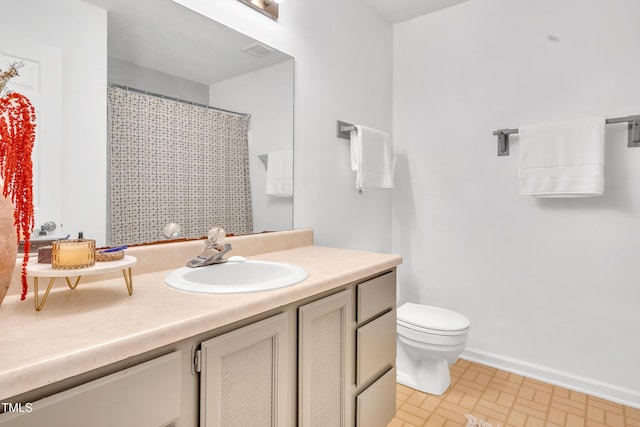 2602 Hitchcock Dr, Durham, NC 27705 - full bath featuring vanity, brick patterned flooring, and curtained shower