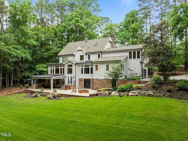 1501 Chatsworth Ln, Raleigh, NC 27614 - rear view of property with a patio area, a sunroom, a chimney, brick siding, and roof with shingles