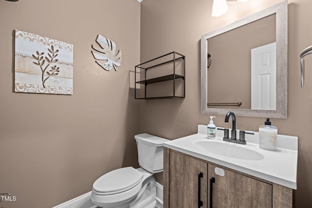 1501 Chatsworth Ln, Raleigh, NC 27614 - bathroom featuring baseboards, toilet, and vanity